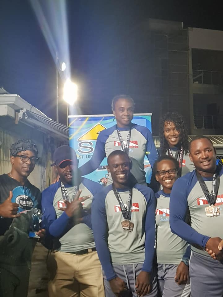 St. Lucia Aquatics Federation Awards Team Sandals with the Trophy for the 2nd Annual Inter Commercial Swim Championship